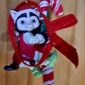 Festive Cat Ornament with Candy Cane and Red Ribbon